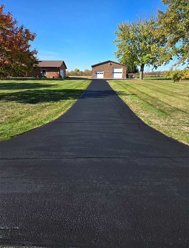 long rural driveway after sealcoating