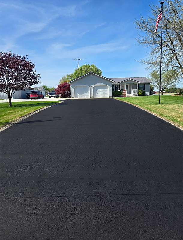 driveway turnaround with fresh asphalt sealer